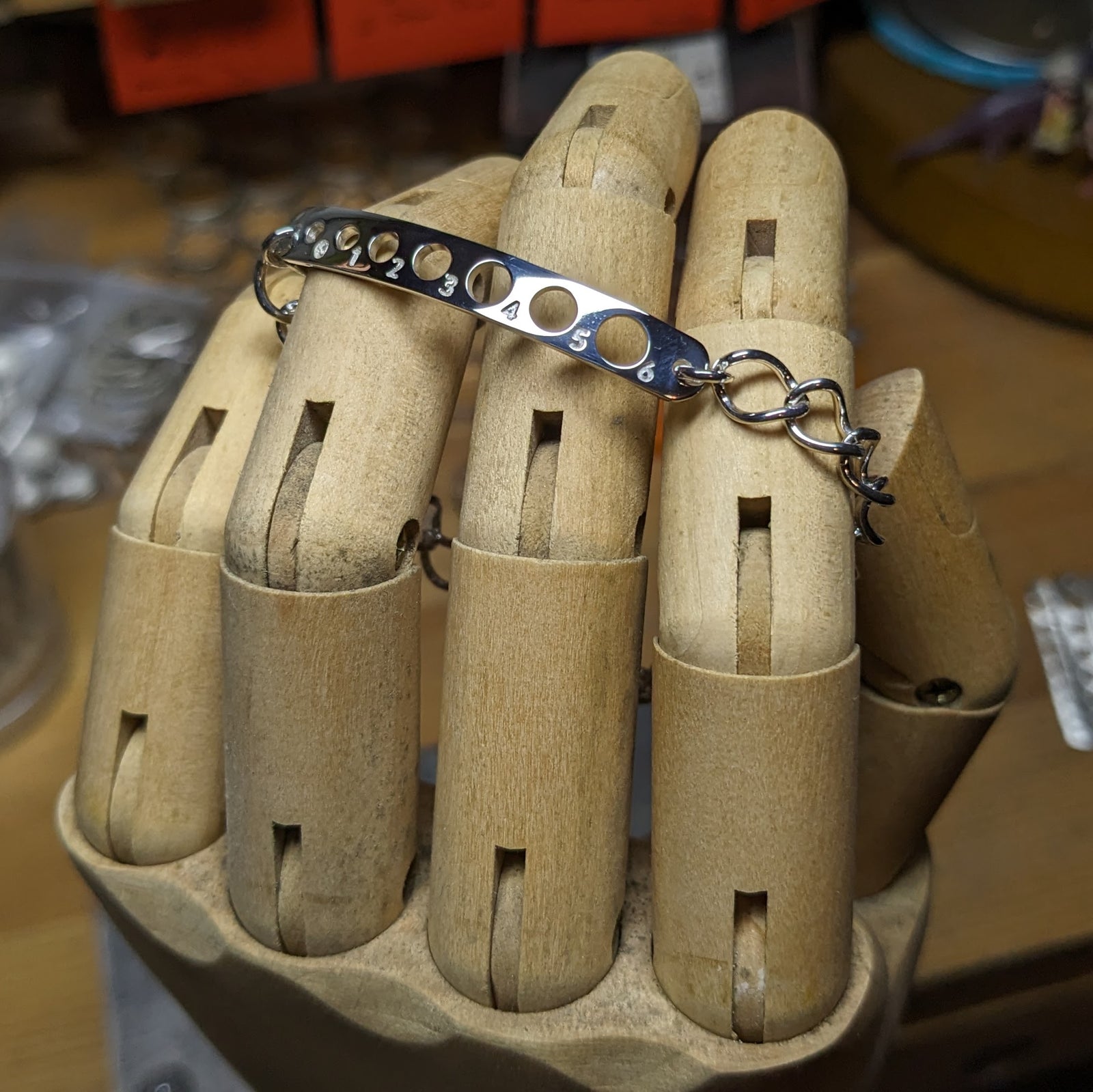 Knitting Needle Gauge Plate Bracelet, US 0-6, in sterling silver.