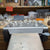 View of a workbench with unfinished silver jewelry.