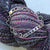 silver plate bracelet with knitting needle gauge holes cut out of the plate